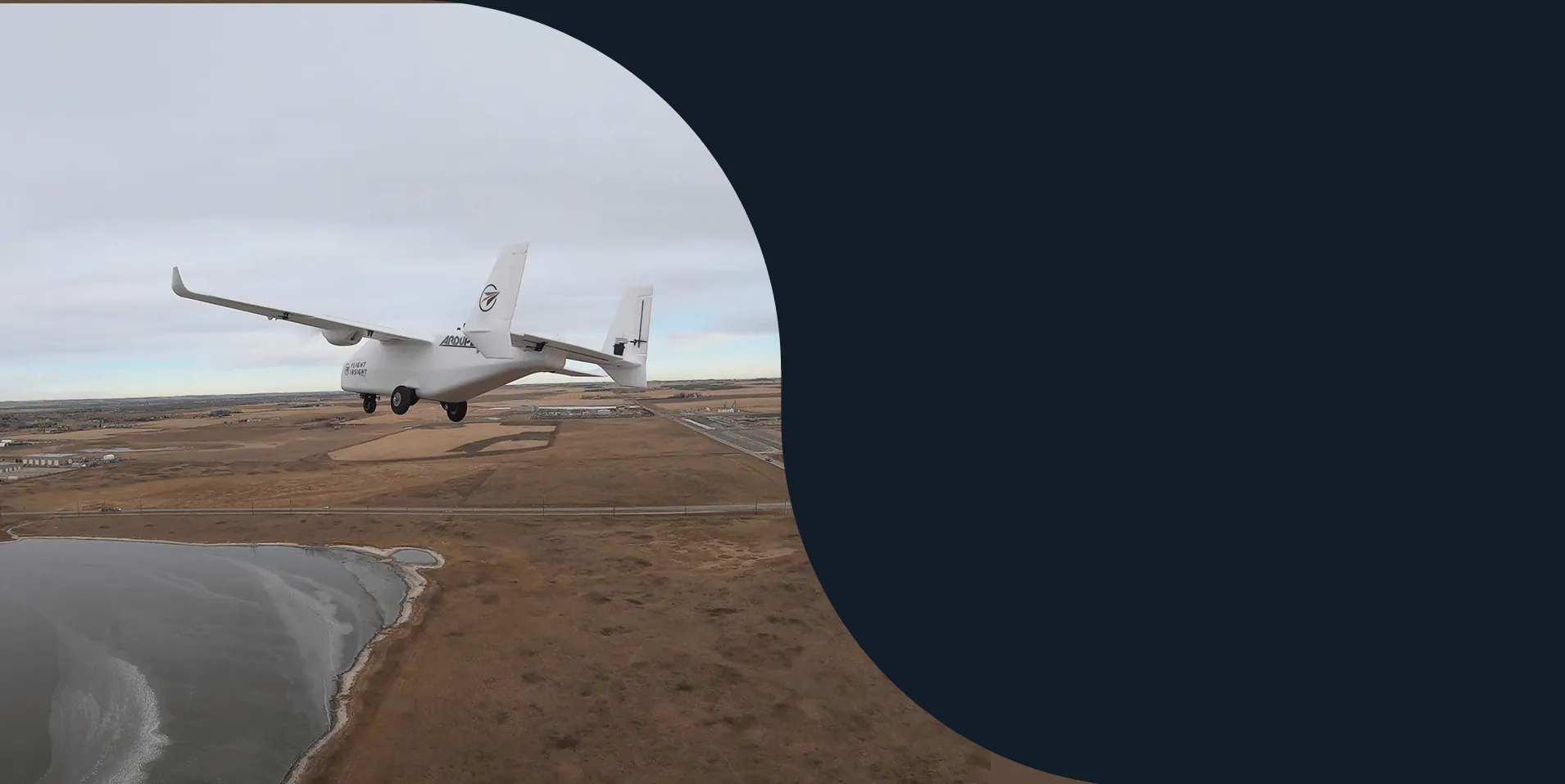 Flight Insight fixed-wing drone carrying EchoTech in flight over Alberta prairie and a frozen lake